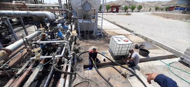 Technical team performing chemical cleaning of a heat exchanger
